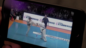 Videography technique filming a smartphone screen askew 